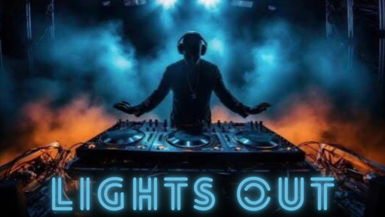 DJ at a mixing desk under blue and amber lights for Lights Out
